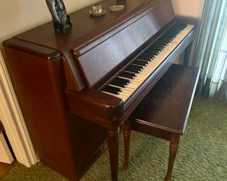 Wurlitzer piano with bench, Art Deco style. 