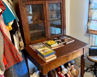 An unusual antique secretary  with built in clock.