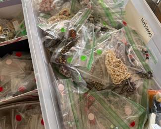 Large tub of necklaces