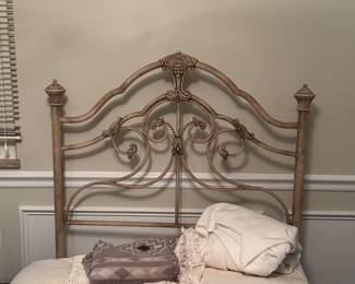 Wrought iron twin bed headboard, box springs, and frame