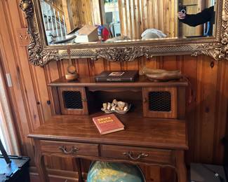 Antique desks. Large framed mirror.