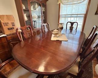 Pristine wood Dining room table with six chairs 