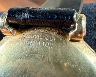 This lot features a vintage Hamilton "Fleetwood" manual-wind wristwatch in a 14k yellow gold case and black leather strap. Winds and runs. 36.5mm lug to lug.

