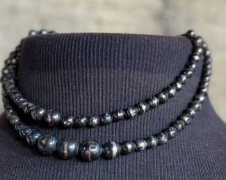 This lot features a vintage sterling silver beaded necklace with a total approx. weight of 23.81 grams. The "inner" necklace/choker measures, 14”.

