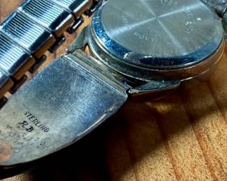 This lot features a beautiful artisan made Zuni watch band that appears to be signed by artist, "RB" as shown in photos.

