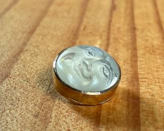 This lot features a carved "moon" moonstone set in 14k gold with a total approx. weight of 1.19 grams.


