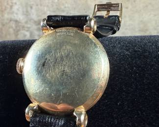 This lot features a vintage Hamilton "Fleetwood" manual-wind wristwatch in a 14k yellow gold case and black leather strap. Winds and runs. 36.5mm lug to lug.

