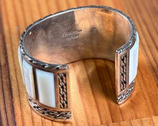 This lot features a beautiful handcrafted Zuni cuff by artist, Florentine Panteah. The cuff measures, 7” and has a total approx. weight of 99.80 grams. 


