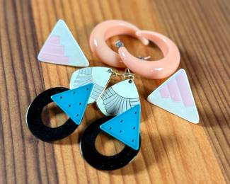 This lot features a curated collection of mid-century style earrings including a pair by Laurel Burch.

