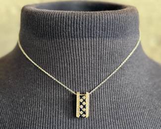 This lot features a stunning 14k yellow gold diamond & sapphire pendant on a gold-filled chain. The pendant comes with an appraisal (in the last photo). This pendant features thirty (30) round full cut diamonds measuring 1.5mm, seven (7) round full cut diamonds measuring 2.2mm, and seven (7) round faceted sapphires measuring 3.0mm. The pendant has a total approx. weight of 4.5 grams.

