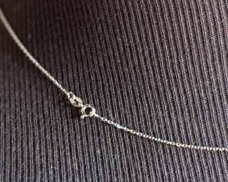 This lot features a 14k gold necklace with genuine pearls. The necklace measures, 18” and has a total approx. weight of 2.18 grams.

