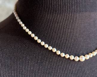 This lot features a beautiful graduated genuine pearl necklace with a 14k gold clasp measuring, 17”.

