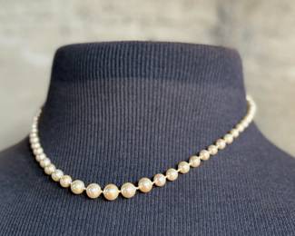 This lot features a beautiful graduated genuine pearl necklace with a 10k gold clasp measuring, 17”.

