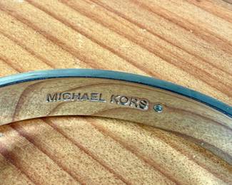 This lot features a pair of bracelets by Michael Kors in very good condition. 

