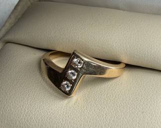 This lot features a 14k gold ring with genuine diamonds in a size 9.25 and a total approx. weight of 4.29 grams.

