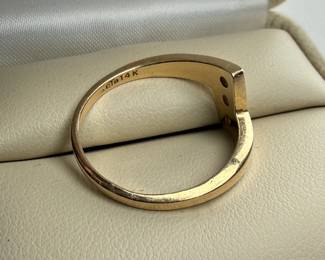 This lot features a 14k gold ring with genuine diamonds in a size 9.25 and a total approx. weight of 4.29 grams.

