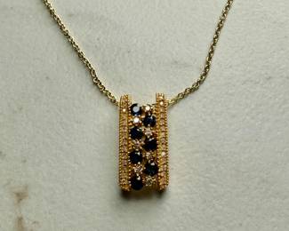 This lot features a stunning 14k yellow gold diamond & sapphire pendant on a gold-filled chain. The pendant comes with an appraisal (in the last photo). This pendant features thirty (30) round full cut diamonds measuring 1.5mm, seven (7) round full cut diamonds measuring 2.2mm, and seven (7) round faceted sapphires measuring 3.0mm. The pendant has a total approx. weight of 4.5 grams.

