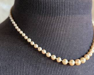 This lot features a beautiful graduated genuine pearl necklace with a 10k gold clasp measuring, 17”.

