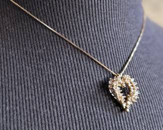 This lot features a stunning diamond heart pendant set in 14k gold on a 14k gold chain. The chain measures, 18” and this piece has a total approx. weight of 8.85 grams. The pendant contains genuine diamonds with a 1.50 carat weight.

