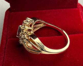 This lot features a 14k yellow gold ring with sixteen (16) round single cut genuine diamonds and one (1) marquise cut ruby. Accompanied with an appraisal, this ring comes in a size 7.75 with a total approx. weight of 4.6 grams.

