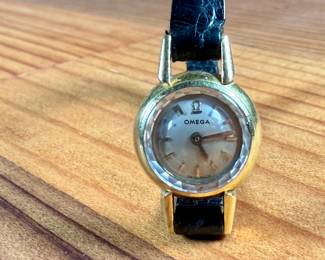 This lot features a vintage Omega ladies watch in a 18k gold case. Winds, but appears to need servicing to run properly. This is a small watch, measuring 24mm lug to lug.

