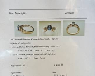 This lot features a 14k gold ring with genuine diamonds and tanzanite in a size 7 with a total approx. weight of 4.0 grams. Accompanied with an appraisal, this ring contains sixteen (16) round full cut diamonds and one (1) oval tanzanite.

