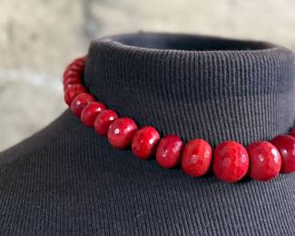 This lot features what is believed to be a graduated red coral necklace with a sterling silver clasp, measuring 17”.

