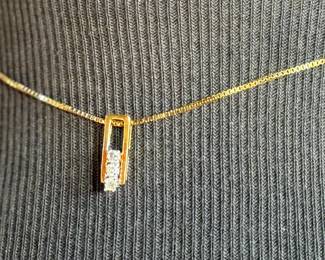 This lot features a stunning 18k gold pendant with genuine diamonds on a gold chain measuring, 16”. Marked 750 with a total approx. weight of 5.03 grams.

