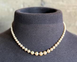 This lot features a beautiful graduated genuine pearl necklace with a 10k gold clasp measuring, 17”.

