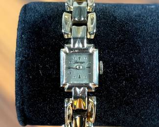 This lot features a 14k gold Leman watch with a total approx. weight of 28.5 grams. The watch is accompanied with an appraisal, is a manual wind with a 17-jewel Pathe Watch Co. movement, and runs/sets fine with safety clasp. The watch is 6.5” in length.

