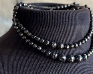 This lot features a vintage sterling silver beaded necklace with a total approx. weight of 23.81 grams. The "inner" necklace/choker measures, 14”.

