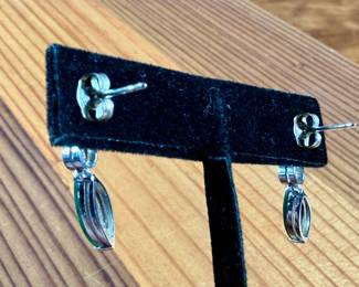 This lot features a pair of 14k gold earrings with genuine diamonds and jade. This set has a total approx. weight of 4.30 grams.

