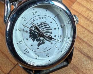 This lot features a beautiful artisan made Zuni watch band that appears to be signed by artist, "RB" as shown in photos.

