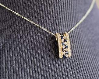 This lot features a stunning 14k yellow gold diamond & sapphire pendant on a gold-filled chain. The pendant comes with an appraisal (in the last photo). This pendant features thirty (30) round full cut diamonds measuring 1.5mm, seven (7) round full cut diamonds measuring 2.2mm, and seven (7) round faceted sapphires measuring 3.0mm. The pendant has a total approx. weight of 4.5 grams.

