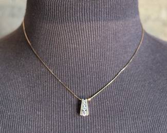 This lot features a beautiful sterling silver pendant with cz diamonds on a 925 chain measuring, 18”.

