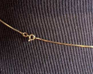 This lot features a stunning 18k gold pendant with genuine diamonds on a gold chain measuring, 16”. Marked 750 with a total approx. weight of 5.03 grams.

