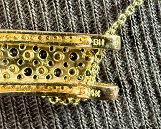 This lot features a stunning 14k yellow gold diamond & sapphire pendant on a gold-filled chain. The pendant comes with an appraisal (in the last photo). This pendant features thirty (30) round full cut diamonds measuring 1.5mm, seven (7) round full cut diamonds measuring 2.2mm, and seven (7) round faceted sapphires measuring 3.0mm. The pendant has a total approx. weight of 4.5 grams.

