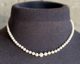 This lot features a beautiful graduated genuine pearl necklace with a 14k gold clasp measuring, 17”.


