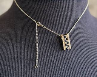 This lot features a stunning 14k yellow gold diamond & sapphire pendant on a gold-filled chain. The pendant comes with an appraisal (in the last photo). This pendant features thirty (30) round full cut diamonds measuring 1.5mm, seven (7) round full cut diamonds measuring 2.2mm, and seven (7) round faceted sapphires measuring 3.0mm. The pendant has a total approx. weight of 4.5 grams.

