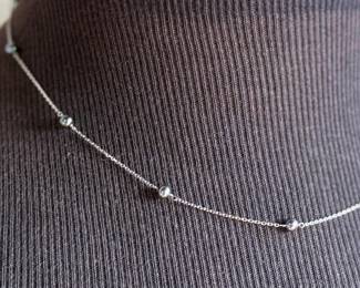 This lot features a 14k gold necklace with genuine pearls. The necklace measures, 18” and has a total approx. weight of 2.18 grams.

