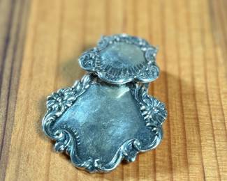 This lot features a sterling silver luggage tag by Foree that measures, 2.5” H x 1.75” W and has a total approx. weight of 30.52 grams.

