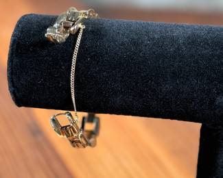 This lot features a 14k gold Leman watch with a total approx. weight of 28.5 grams. The watch is accompanied with an appraisal, is a manual wind with a 17-jewel Pathe Watch Co. movement, and runs/sets fine with safety clasp. The watch is 6.5” in length.

