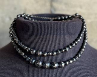 This lot features a vintage sterling silver beaded necklace with a total approx. weight of 23.81 grams. The "inner" necklace/choker measures, 14”.


