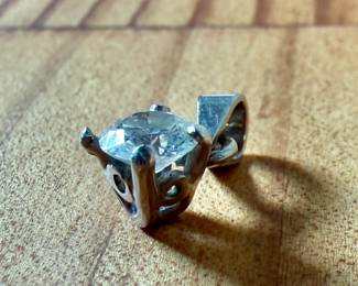 This lot features a 14k white gold pendant with a nearly 1/2 carat diamond. Total approx. weight of 1.18 grams.

