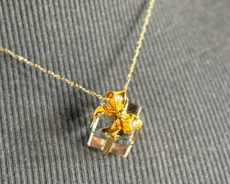 This lot features a Swarovski crystal pendant on a chain measuring, 18”.

