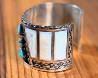 This lot features a beautiful handcrafted Zuni cuff by artist, Florentine Panteah. The cuff measures, 7” and has a total approx. weight of 99.80 grams. 

