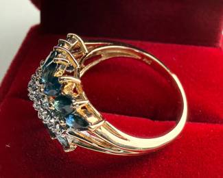 This lot features a stunning 14k gold two-tone diamond & sapphire ring. Accompanied with an appraisal, this ring comes in a size 7.75 and a total approx. weight of 4.6 grams. This ring contains fourteen (14) marquise cut sapphires and nine (9) single cut diamonds.

