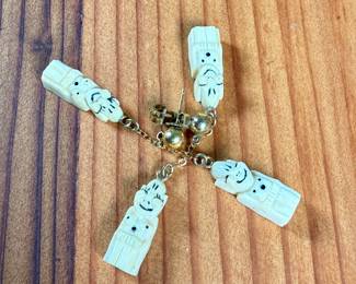 This lot features an antique Alaskan Inuit Billiken, held together by 12k gold fill.

