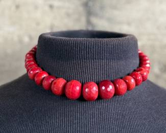 This lot features what is believed to be a graduated red coral necklace with a sterling silver clasp, measuring 17”.

