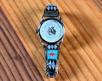 This lot features a beautiful artisan made Zuni watch band that appears to be signed by artist, "RB" as shown in photos.

